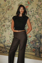 Model wearing Asymmetric front pants and a crop tencel knit sweater 