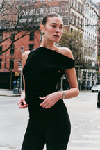 Model wearing the Arue Studios Balance Knit Sweater, a soft women’s knit top designed with a minimal silhouette and lightweight feel.
