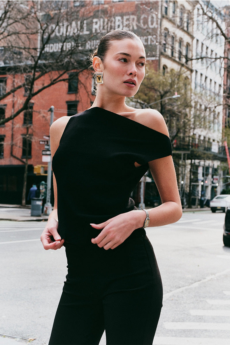 Model wearing the Arue Studios Balance Knit Sweater, a soft women’s knit top designed with a minimal silhouette and lightweight feel.
