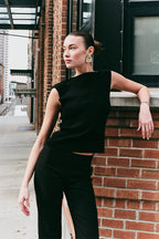 Model wearing the Arue Studios Balance Knit Sweater, a soft women’s knit top designed with a minimal silhouette and lightweight feel.
