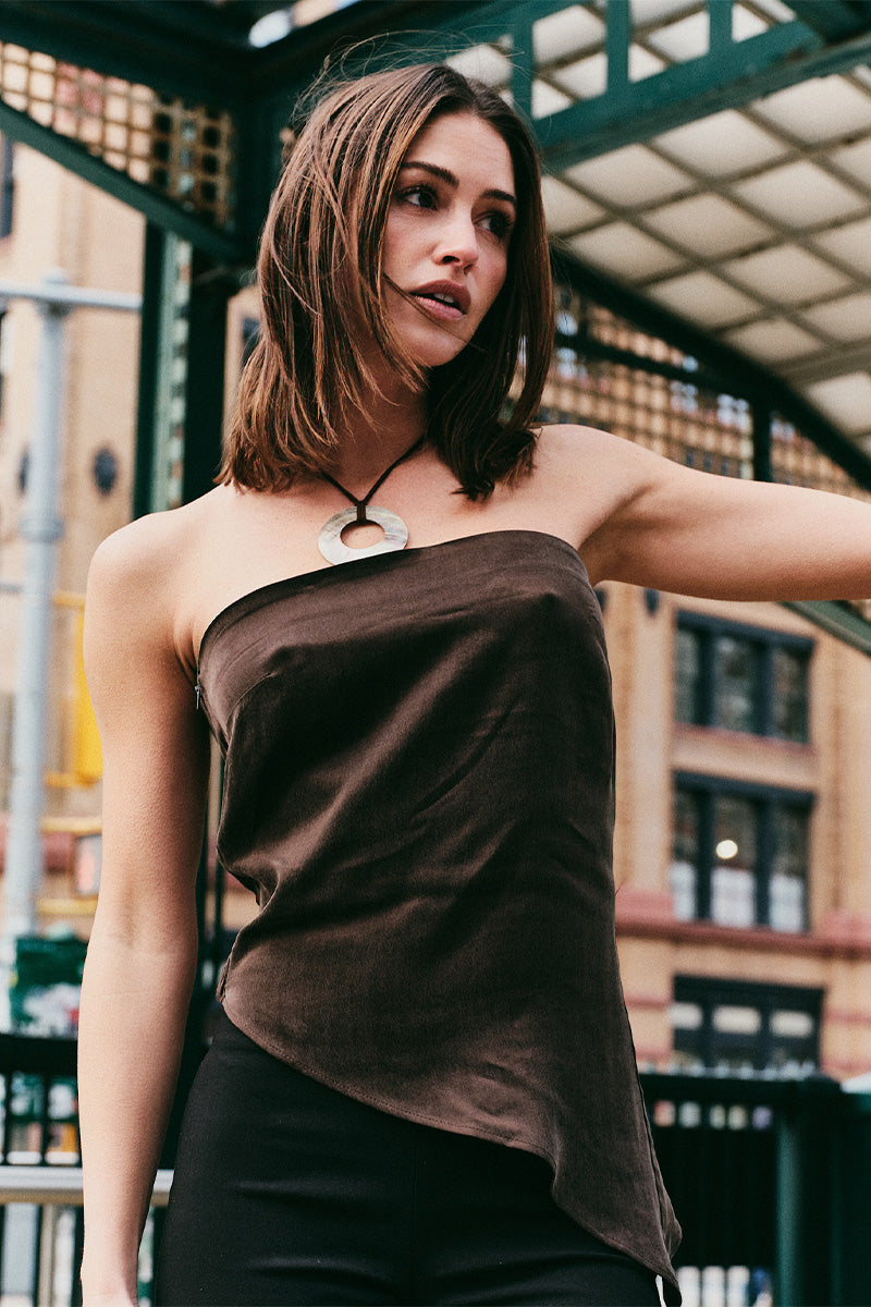 Model wearing a strapless brown top in New York.