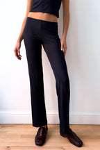Model wearing the Still Micromodal Pant in navy, a soft low-rise straight-leg pant styled with matching top and leather loafers.