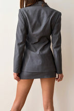 Back view of tailored charcoal jacket with clean lapels
