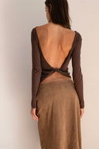 Model wearing the espresso Twist Top with a boat neckline, long sleeves, and a softly fitted silhouette.