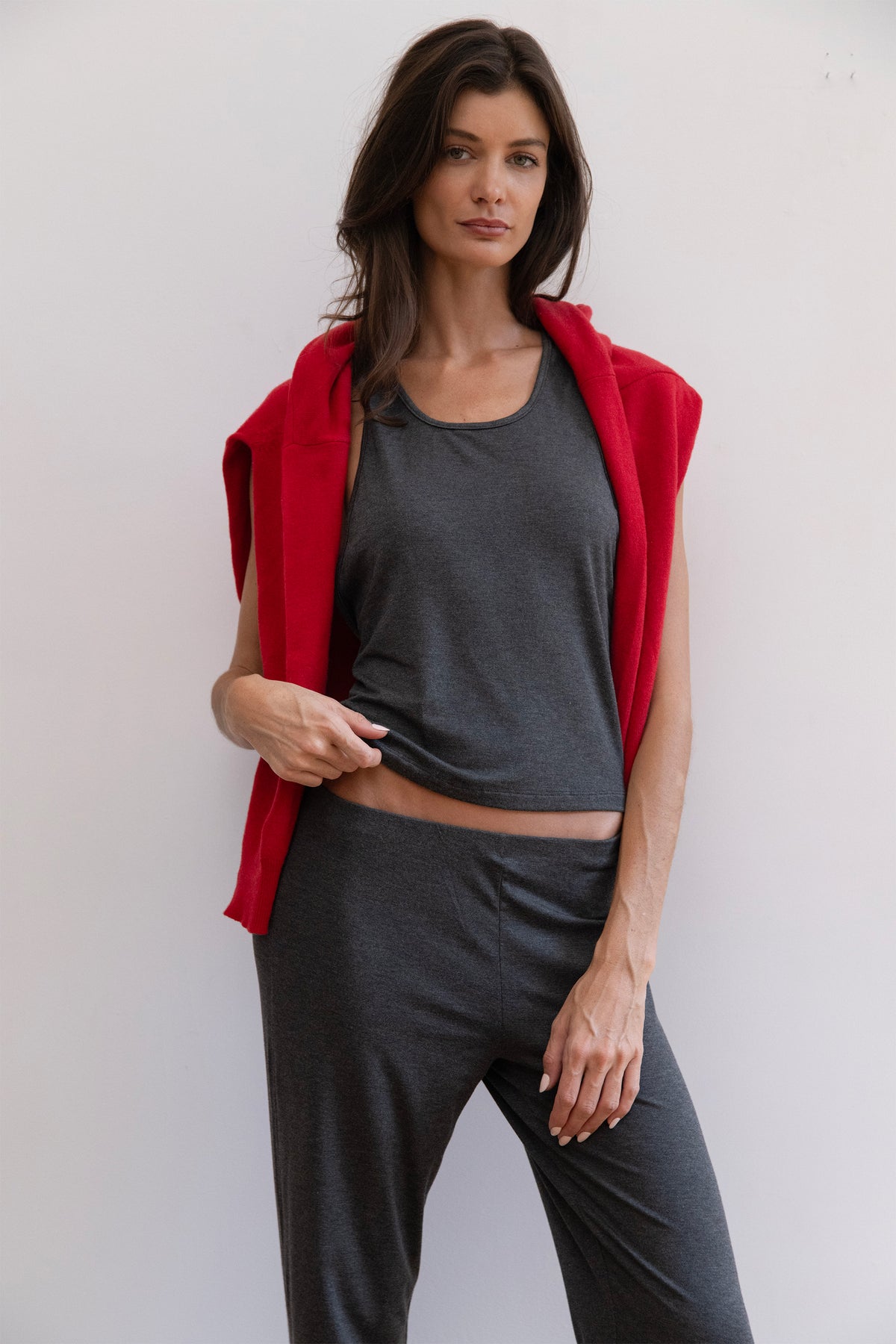 Model wearing a charcoal tank top and matching charcoal pants